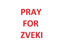 a sign that says pray for zveki in red letters on a white background