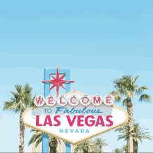 a welcome to fabulous las vegas sign is surrounded by palm trees