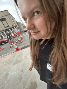 a girl stands in front of a building that says ' rtm ' on it