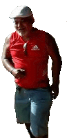 a man wearing a red adidas tank top and blue shorts is walking .