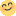 a blurry picture of a yellow smiley face with a smile on it 's face .