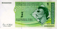 a green banknote with a picture of a man and the number 1