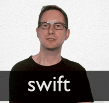 a man wearing glasses and a black shirt says swift