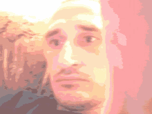 a pixelated image of a man 's face with a surprised expression