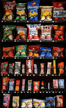 a vending machine filled with chips and snacks including doritos