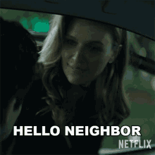 a woman in a car is smiling and says hello neighbor netflix