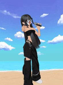 a girl with glasses is singing into a microphone on a beach