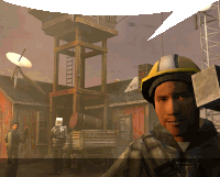 a man wearing a hard hat is smiling in front of a tower