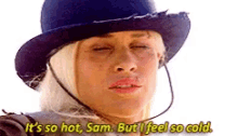 a woman wearing a cowboy hat is saying it 's so hot , sam . but i feel so cold .