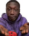 a man wearing a purple hoodie is holding a red ball in his hands .