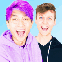 a boy with purple hair and glasses is next to another boy with blue eyes