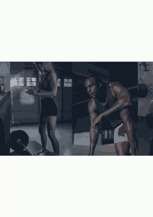 a man and a woman in a gym with a parking sign in the background