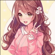 a girl with long hair and a flower in her hair is wearing a pink jacket and giving a peace sign .