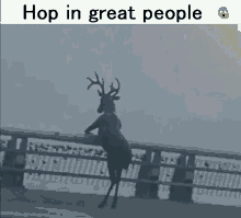 a picture of a deer standing on a railing with the caption hop in great people