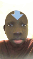 a close up of a person 's face with a blue arrow on their forehead .