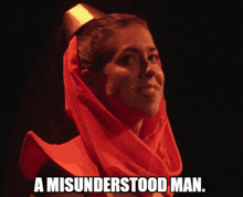 a woman with a red scarf around her head and the words a misunderstood man below her