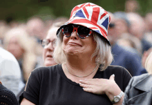 a woman wearing a hat with a union jack on it