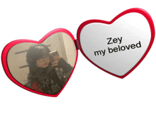 a heart shaped mirror that says zey my beloved on it