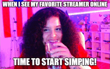 a woman with curly hair is drinking from a glass in front of a purple background .