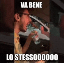 a man drinking water in a car with a meme that says va bene lo stess000000