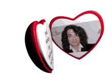 a heart shaped plaque with a picture of paul stanley