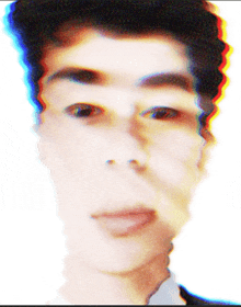 a blurry picture of a man 's face with a red blue and white border