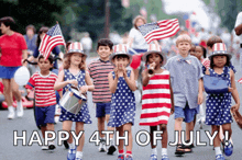 a group of children march down a street with the words happy 4th of july