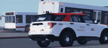 a white and red vehicle with the word transit supervisor on the side