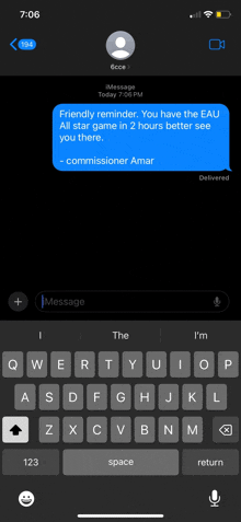 a phone screen shows a message from a person named commissioner amar