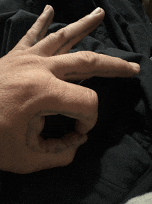 a close up of a person 's hand with a tattoo that says ' i love you '