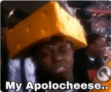 a man is wearing a cheese hat and saying `` my apolo cheese '' .