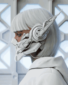 a woman with white hair is wearing a futuristic helmet with headphones attached to it