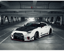 a white liberty walk car is parked in a garage