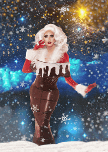 a drag queen in a christmas costume with snowflakes on the background