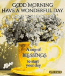 a cup of blessings to start your day is sitting on a saucer next to a vase of flowers .