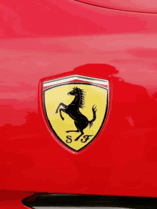 a red car with a ferrari emblem on the side