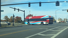 a red white and blue bus with the word cruz on the side of it