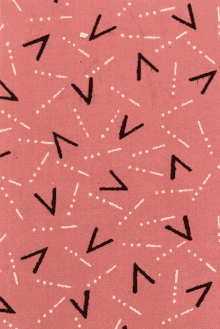 a pink background with black arrows and white dots on it