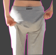 a person wearing sweat pants with a pink outline around their waist