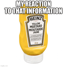 a bottle of heinz yellow mustard is sitting on a white surface