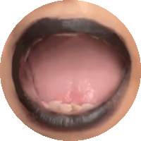 a close up of a person 's mouth with their tongue sticking out