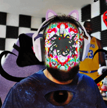 a man wearing headphones has a colorful face painted on his face