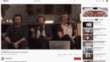 a group of men are sitting in front of microphones on a youtube screen