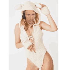 a woman in a sheep costume with a man 's face on her face