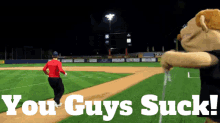 a man running on a baseball field with the words you guys suck above him