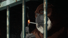 a monkey is smoking a cigarette through a cage