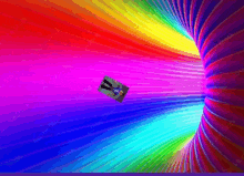 a picture of a person flying through a rainbow colored tunnel