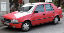 a red car with a license plate that says ul73388