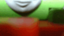 a blurred image of a person 's face with a smile on their face