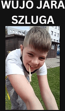 a picture of a boy with a pencil in his mouth with the words wujo jara szluga written above him